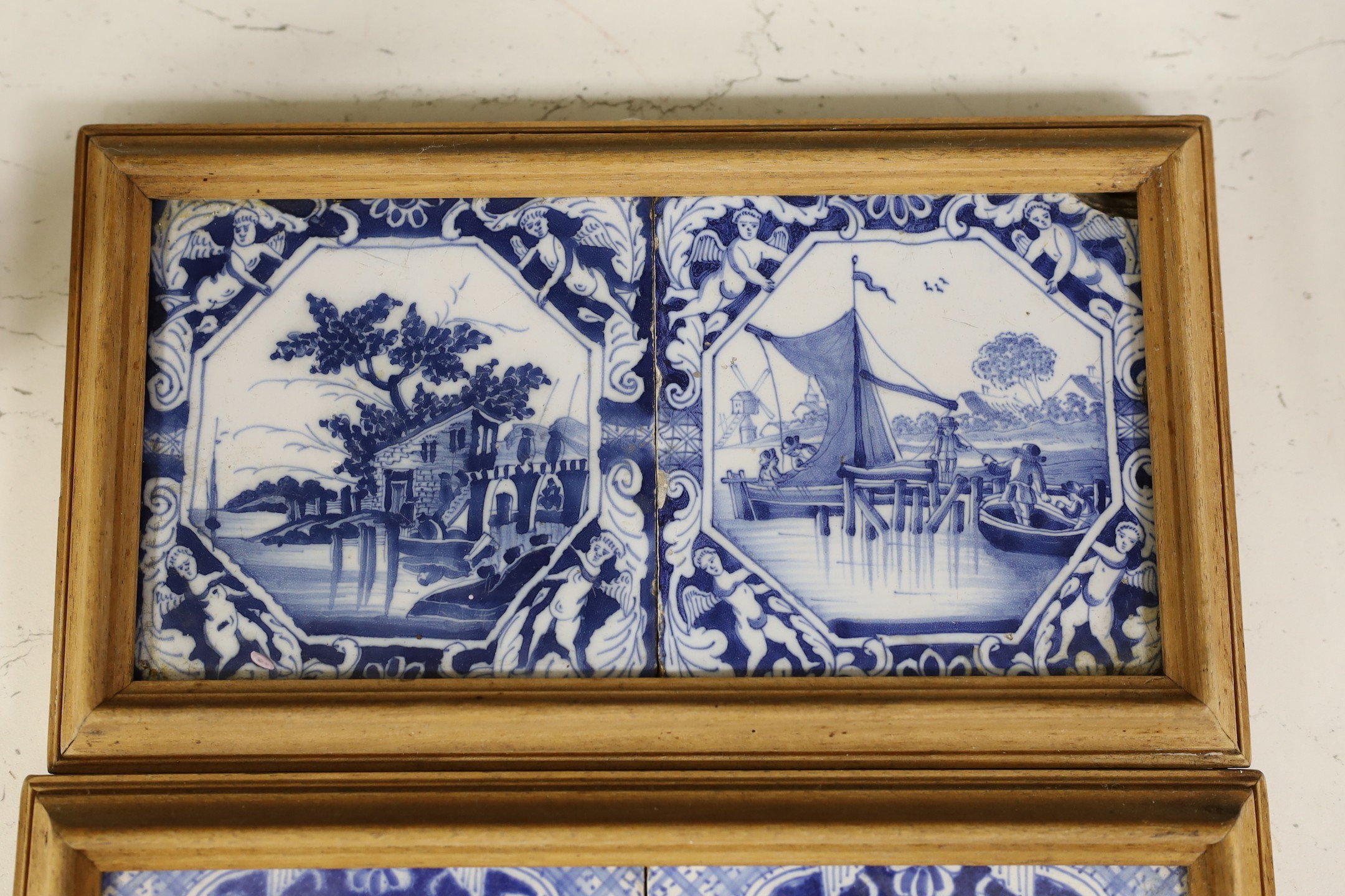 Three pairs of Delft blue and white ‘landscape’ tiles, 18th/19th century, in double frames